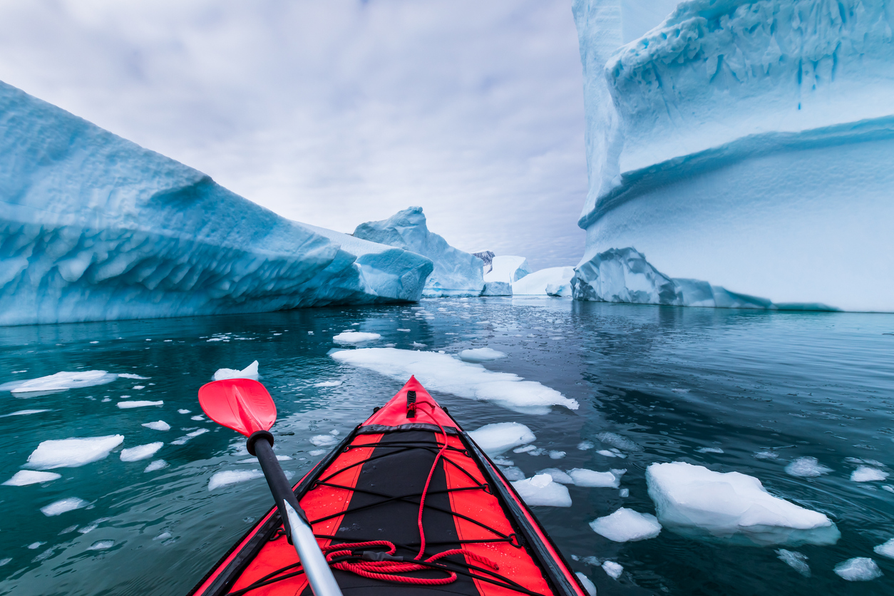 Kayaking in Antarctica between icebergs with inflatable kayak, extreme adventure in Antarctic Peninsula , beautiful pristine landscape, sea water paddling activity Cindy Bakewell Travel Antarctica